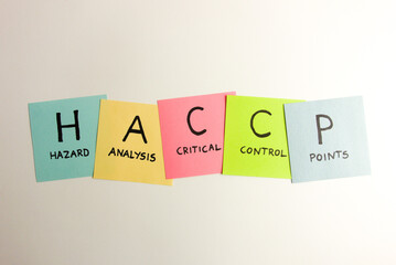 HACCP - Hazard Analysis Critical Control Point acronym handwritten on colorful sticky notes