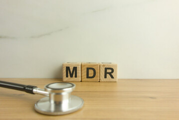 MDR Medical Device Regulation acronym from wooden blocks with stethoscope