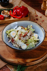 salad with quail eggs and dried tomatoes. Top view