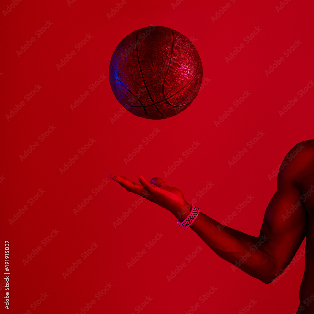 Poster What you do with it is up to you. Red filtered shot of an unrecognizable sportsman posing with a basketball in the studio.