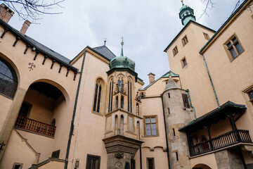 Kutna Hora, Central Bohemian, Czech Republic, 5 March 2022: Italian Courtyard or Vlassky dvur, medieval architecture gothic and renaissance, tower with lancet window and stained-glass windows