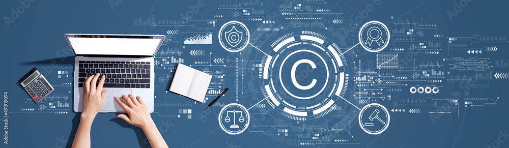 Poster copyright concept with person using a laptop computer