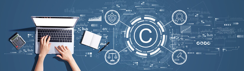 Copyright concept with person using a laptop computer