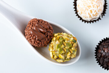 Top view of Chocolate and Pistachio Brigadeiro. Brazilian party candy