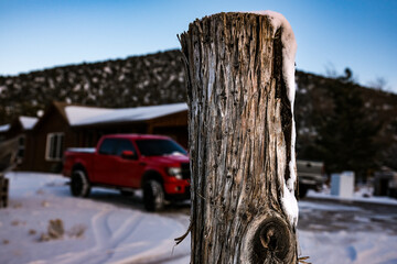 Fence post in the winter snow