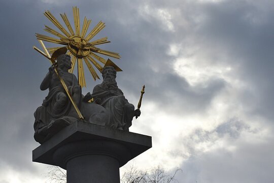 Statue of the Holy Trinity from year 1820, located near Basilica of Virgin Mary of Seven Grievances of Sastin Straze, western Slovakia.  Spring cloudy skies in background.