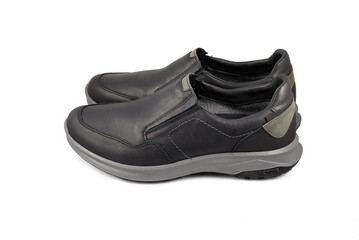 Black leather shoes isolated on white background. Full depth of field. Close-up.