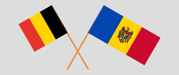 Crossed flags of Belgium and Moldova. Official colors. Correct proportion