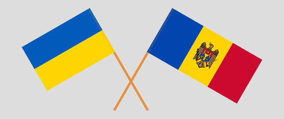 Crossed flags of Ukraine and Moldova. Official colors. Correct proportion