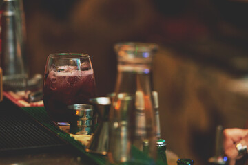 Female barman preparing drinks. cocktail bar Drinks at the bar. Fresh and cold drinks in a bar. Watermelon drink, jamiaca drink, margarita, micheladas.
