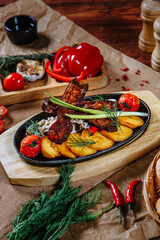 frying pan with mushrooms, potatoes and fried bacon. Top view