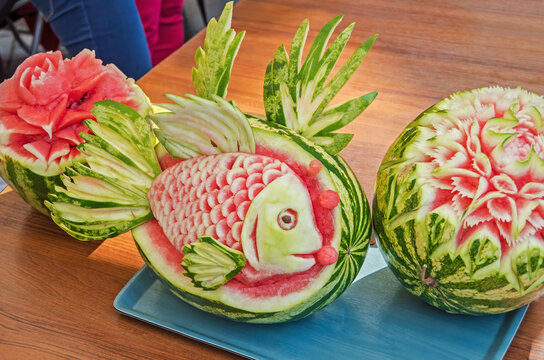 Carving on ripe watermelons