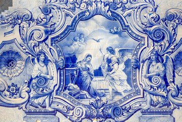 a religious scene painted in blue azulejos at the monumental stairway to Our Lady of Remedies Sanctuary, Lamego, Viseu, Portugal - obrazy, fototapety, plakaty