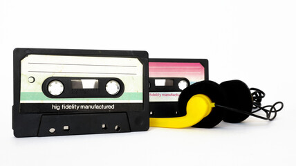Vintage Cassette tape and headphones isolated on a white background