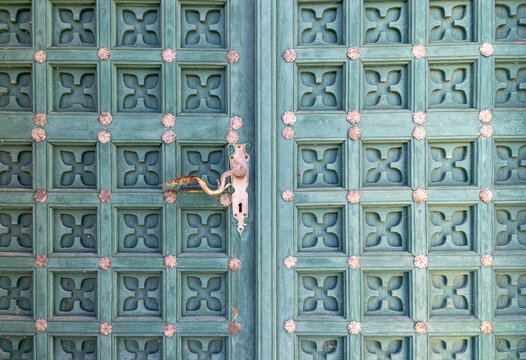 Old carved green wooden door