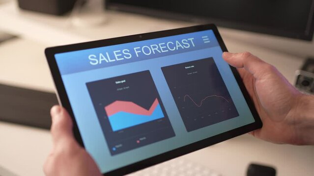 Sales Forecast on a Tablet Computer With Graphs and Charts