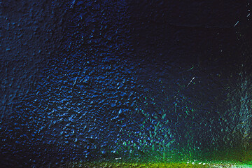 Abstract texture. Stone background. Rock texture. Dark stone wall. Rock surface with holography, nacre. Stone texture for designers. Wall abstraction. Paint spots. Rock surface with cracks.