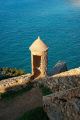 Ericeira Milreu Fort castle towers with turquoise water, in Portugal