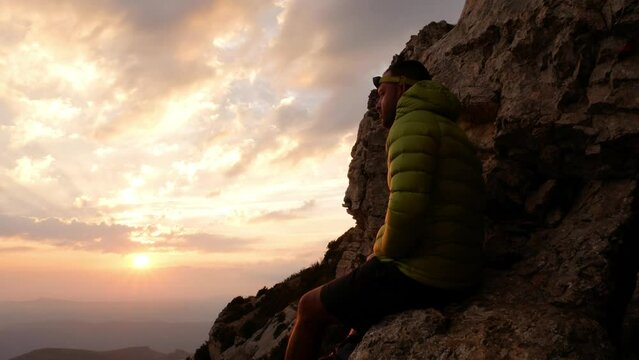 Man looking at the horizon during a hike in the mountains.