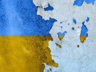 Flags of Ukraine on cracked cement of old damaged wall texture, background.