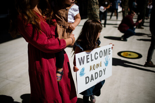 Mother & Two Daughers Waiting for Military Homecoming in San Diego