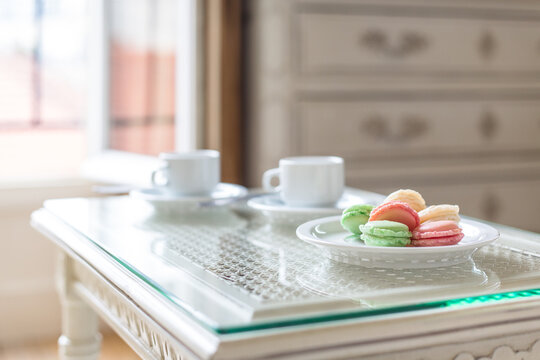 Table setting for breakfast or tea time with macarons
