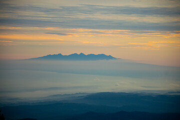 colorful sunrise at the highest peak of Mount Si Kunir, Mount Dieng, Wonosobo, Indonesia 