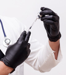 doctor holding syringe