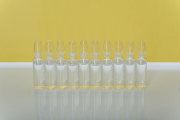 Glass medical ampoule vial for injection. Medicine is liquid sodium chloride with of aqueous...