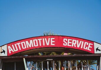 Old worn automotive service sign