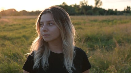 portrait of a beautiful European girl with loose hair against the background of nature. selective focus