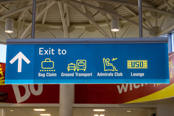 Airport sign board Ground Transport Admirals Club Lounge Baggage Claim in air terminal