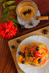 Hotcakes served ready for breakfast. Hotcakes decorated with strawberries.