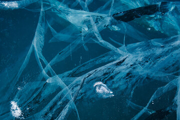 Texture of winter ice surface. Blue natural ice background
