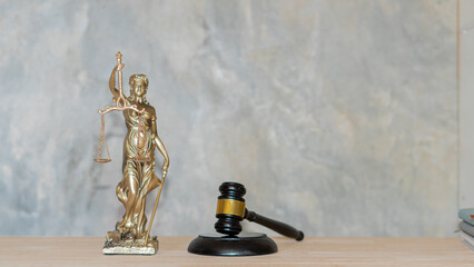 sculpture justice bronze lady and book and hammer with laptop Blind justice symbol on concept metal...