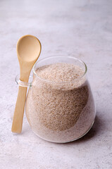 Brown psyllium in a glass jar