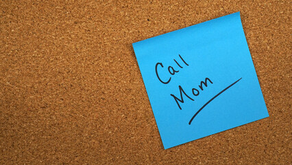 Sticky note reminder to call mom, especially on Mother's Day.