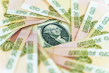 Russian and American paper money. Rubles and US dollars exchange rate.