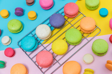 Colorful macaroons variety. colorful macarons dessert with vintage pastel tone. Sweet colorful macaroons on color background	