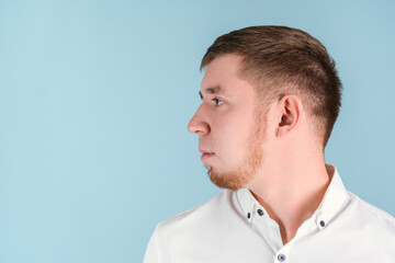 Portrait of a bearded man in profile turning his head to the right, copyspace