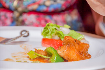 fish with vegetables in sweet and sour gravy sauce.