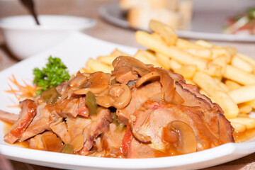 chops of fresh lambs cooked in sweet and sour sauce,