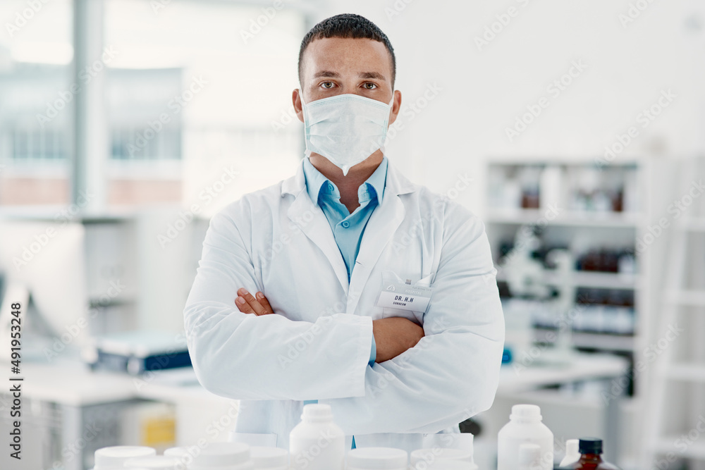 Poster ill do my best to make a breakthrough. portrait of a confident young scientist wearing a mask in a m