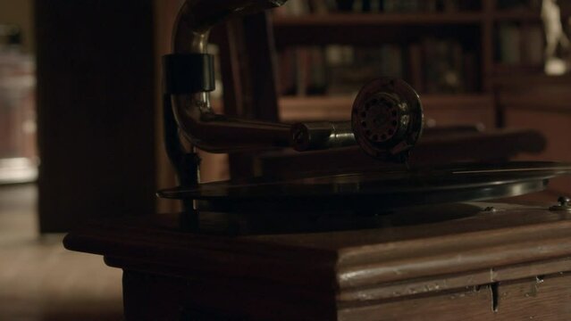 Old vinyl record player in a library in a hacienda style home.