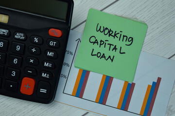 Working Capital Loan write on sticky notes isolated on Wooden Table.