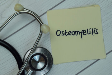 Osteomyelitis write on sticky notes isolated on Wooden Table. Medical concept