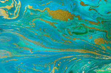 Gold waves on flow blue paints background. Abstract print