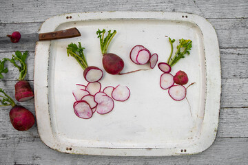 Cut radishes on a rustic veggie tray
