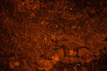 Orange color painted old damaged rough concrete wall surface for texture