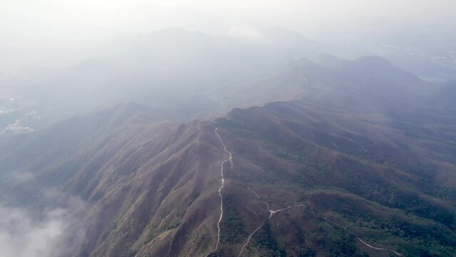 Aerial footage flying through the Wong Leng, Pat Sin Leng, Tai Po, Hong Kong. In a cloudy day